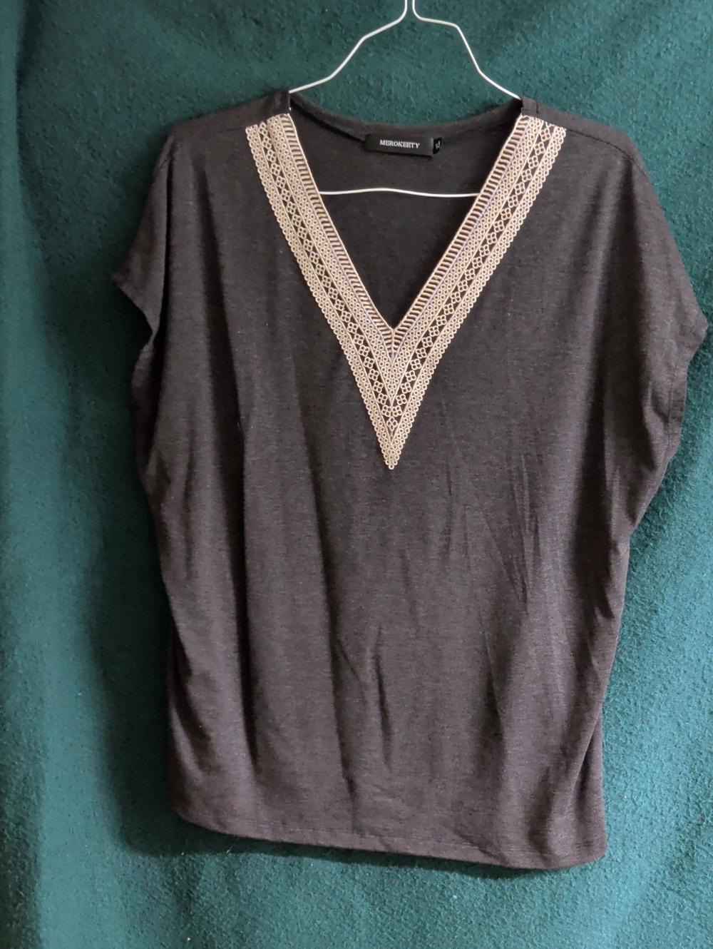 Merokeety Black Top with Cream Crochet V-Neck